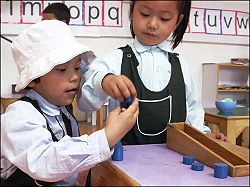 Girls at The Druk White Lotus School learning with Montessori materials