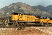 An eastbound Union Pacific Railroad train working upgrade on Cajon Pass in 1991.