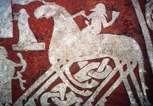 A depiction of Odin entering Valhalla riding on Sleipnir from the Tängvide image stone.