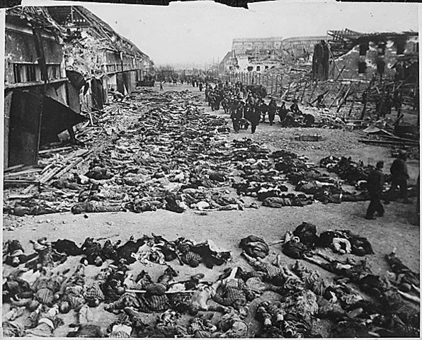 Image:Rows of bodies of dead inmates fill the yard of Lager Nordhausen, a Gestapo concentration camp.jpg