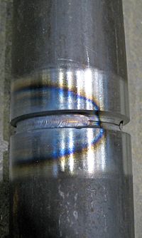 The blue area results from oxidation at a corresponding temperature of 600 °F (316 °C). This is an accurate way to identify temperature, but does not represent the HAZ width. The HAZ is the narrow area that immediately surrounds the welded base metal.