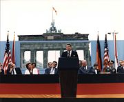 United States President Ronald Reagan delivers his famed speech at the Berlin Wall in June 1987, in which he called for Soviet General Secretary Mikhail Gorbachev to "tear down this wall!"
