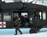 A Blackhawk helicopter as the crew prepares to evacuate tourists stranded by an avalanche in Galtür, Austria, on February 25, 1999.