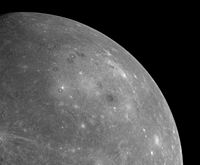 MESSENGER's first image of the unseen side of Mercury from a distance of about 17,000 miles (27,000 km) cropped to highlight Caloris. The rim is hard to discern as the Sun is directly overhead, preventing shadows.