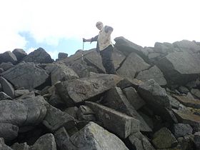 Ascending the scree slope on the west flank of Cross Fell