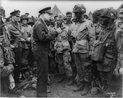 Eisenhower speaks with 1st Lt. Wallace C. Strobel and Company E, 502d Parachute Infantry Regiment, 101st Airborne Division on the evening of June 5, 1944.