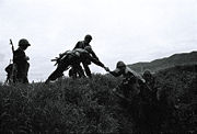 NKR soldiers from the 8th regiment rush out of a trench during an exercise operation on the Agdam front on the most eastern side in Agdam.