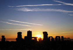 The sun rising over Stonehenge on the summer solstice on 21 June 2005
