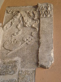 Roman axe in an ancient Roman relief in Brescia, Italy