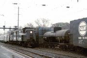 Amtrak #928, a former PRR GG1, speeds through North Elizabeth, New Jersey in December 1975.