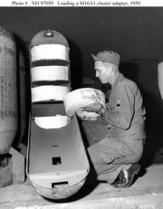 Soldier loads a "leaflet bomb" during the Korean war.