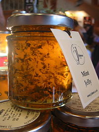 A jar of mint jelly. Mint jelly is a traditional condiment served with lamb dishes.