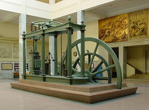 A Watt steam engine in Madrid. The development of the steam engine propelled the Industrial Revolution in Britain and the world. The steam engine was created to pump water from coal mines, enabling them to be deepened beyond groundwater levels.