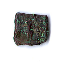 Coin showing Karttikeya and Lakshmi (Ujjain, circa 150–75 BC)