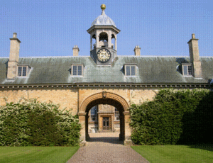 The approach to the house through the courtyard to the west entrance (C on plan below). This is the entrance which would have been used most often by the family, who lived privately in the west wing. The clock tower is designed on an axis with, and to complement, the cupola on top of the mansion itself.