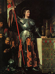 Joan at the coronation of Charles VII, by Jean Auguste Dominique Ingres (1854), is typical of attempts to feminize her appearance. Note the long hair and the skirt around the armor.