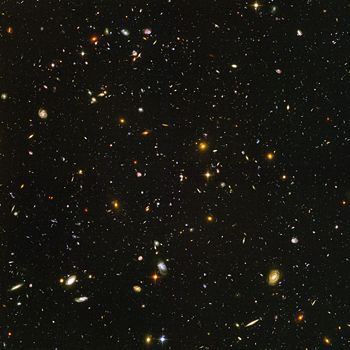 Hubble Ultra Deep Field image of a small region of the observable universe, near the constellation Fornax.   The light from the smallest, most redshifted galaxies originated roughly 13 billion years ago.