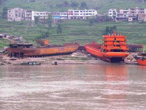 A shipyard on the banks of the Yangtze building commercial river freight boats