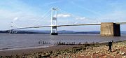 The Severn Bridge seen from the English side of the river.  From 1966 to 1996, the bridge carried the M4 motorway. On completion of the Second Severn crossing the motorway from Aust on the English side to Rogiet was renamed the M48