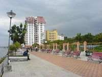 Pedestrians can stroll along the Marine Drive, a waterfront promenade of Kochi.