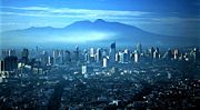Jakarta skyline and Mount Gede