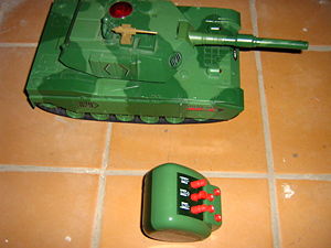 A toy tank with a remote control.  Such toys are generally thought of a boys' toys, but some girls enjoy playing with them also.
