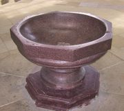 Baptismal Font made of rose porphyry.