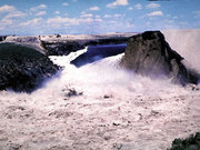 The reservoir emptying through the failed Teton Dam.