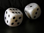 Two standard six-sided pipped dice with rounded corners.