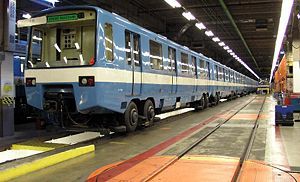 An older generation MR-63 train is in the Beaugrand Garage. Note the turntable to change trucks in the foreground.