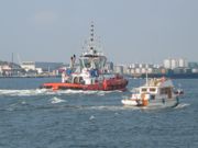 A small pleasure boat and a tugboat in Rotterdam