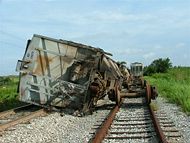 Empty railroad hopper cars overturned as a result of high winds from Hurricane Charley – Fort Meade, Florida.