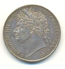 Half-Crown of George IV, 1821. The inscription reads GEORGIUS IIII D[ei] G[ratia] BRITANNIAR[um] REX F[idei] D[efensor] (George IV, by the grace of God King of the Britains (British kingdoms), Defender of the Faith). George IV was the last British King to be shown on coins wearing a Roman-style laurel wreath.