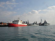 Four commissioned ships of the Royal Navy in Portsmouth dockyard; HMS Endurance, the Type 42 destroyer HMS Liverpool, the historic Ship of the line HMS Victory and the aircraft carrier HMS Ark Royal.