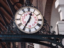 Platform clock at King's Cross railway station, London.