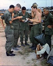 An alleged NLF activist, captured during an attack on an American outpost near the Cambodian border, is interrogated.