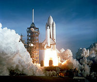 Columbia launching during STS-1. The original white-painted external tank, as well as Columbia's distinctive black chines, are clearly visible