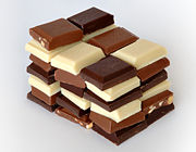 Chocolate most commonly comes in dark, milk, and white varieties, with cocoa solids contributing to the brown coloration.