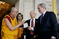 The Dalai Lama receiving a Congressional Gold Medal in 2007. George W. Bush, Robert Byrd, and Nancy Pelosi are on his left.