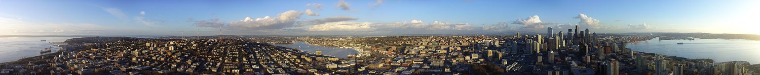 Queen Anne Hill (left center), Lake Union (center), the Downtown Seattle skyline (right center), and Elliott Bay (right) are important aspects of Seattle's cityscape viewed from the Space Needle.