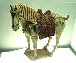 A Chinese Tang Dynasty tri-colored glaze porcelain horse (ca. 700 AD).
