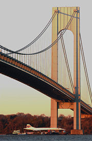 Concorde G-BOAD on a barge beneath Verrazano Narrows Bridge in New York City in November 2003, bound for the Intrepid Sea-Air-Space Museum