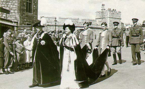 King George VI and Queen Elizabeth lead the processions of Knights of the Garter from the castle's Upper Ward to St George's Chapel.