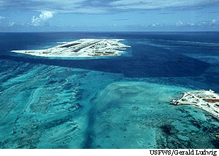 Approaching the runway on Johnston Island from the north-east with Sand Island partially visible on the right. The base was closed and the airport inactivated on June 15, 2004.