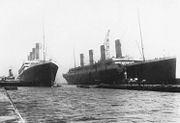 6 March 1912: Titanic (right) had to be moved out of the drydock so her sister Olympic, which had lost a propeller, could have it replaced. On the left Olympic is about to enter the drydock with the help of the tugs