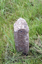 A remnant of an original "STATE" right-of-way marker serves as a "ghost" of the early days of the road's construction. This was part of the 1927 construction of Route 66.