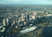 Perth Convention Exhibition Centre seen from the air between the Perth CBD and Swan River