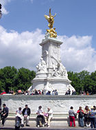 The Victoria Memorial was created by sculptor Sir Thomas Brock in 1911 and erected in front of the main gates at Buckingham Palace on a surround constructed by architect Sir Aston Webb.