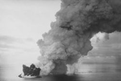 Surtsey's ash column rises over the newly forming island