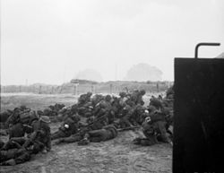 A group of British infantry waiting to leave Sword Beach, 6 June 1944.